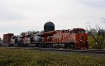 Heritage unit The "J", CN 3023 with CN 3844 and 3877 leading an E/B unit stack train through the CP Page Sub turnout to the Mision swing bridge.